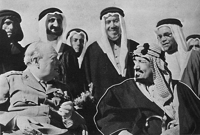 Winston Churchill (foreground L) talks with Middle Eastern rulers