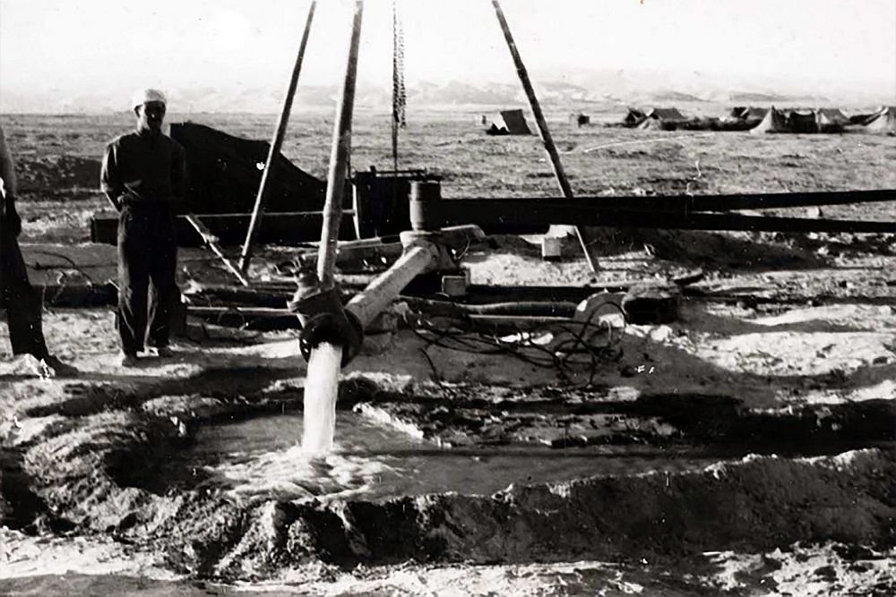 Palestinian laborers dig a well at the Arab Development Society site, Jericho, 1950.
