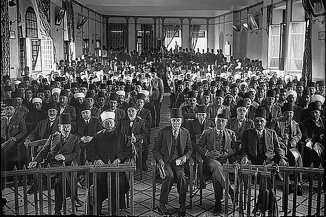 Arab protest delegation against British policy in Palestine (subsequent to the al-Buraq Uprising), meeting in the hall of the Rawdat al-Ma'arif school, Jerusalem, 1929